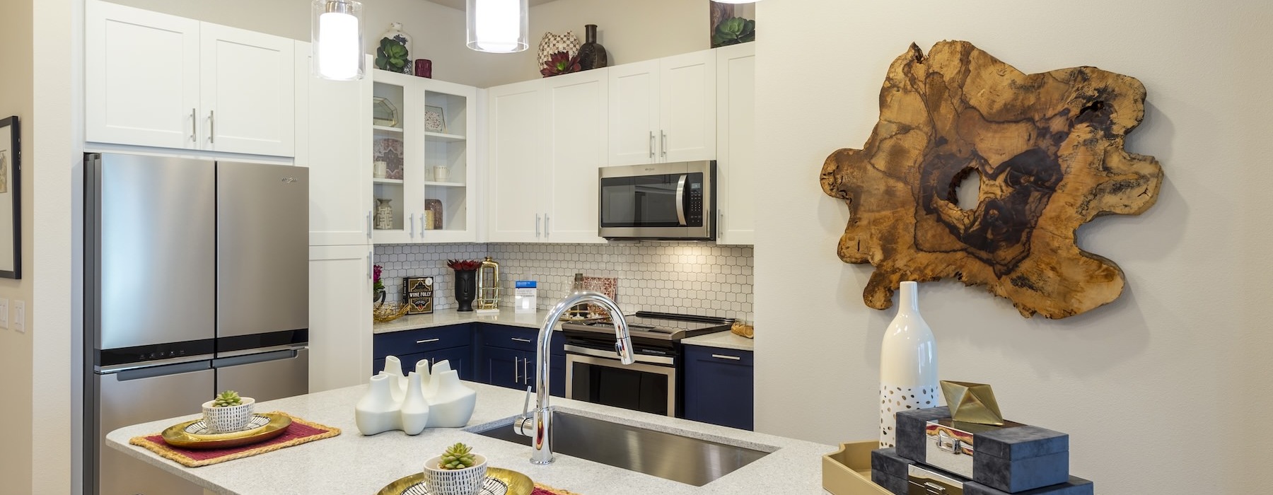 a kitchen with white cabinets