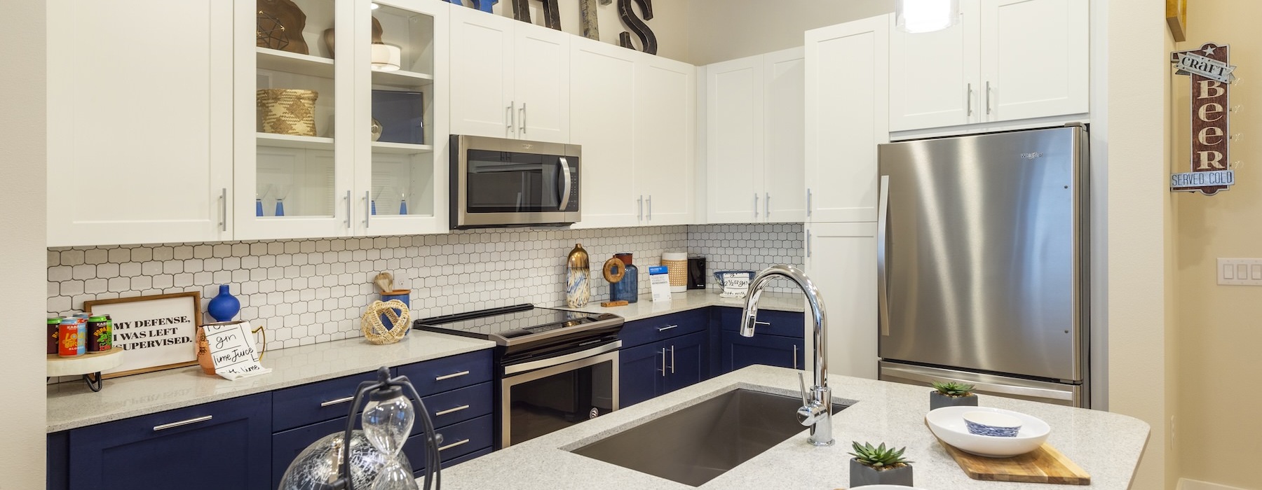 a kitchen with white cabinets