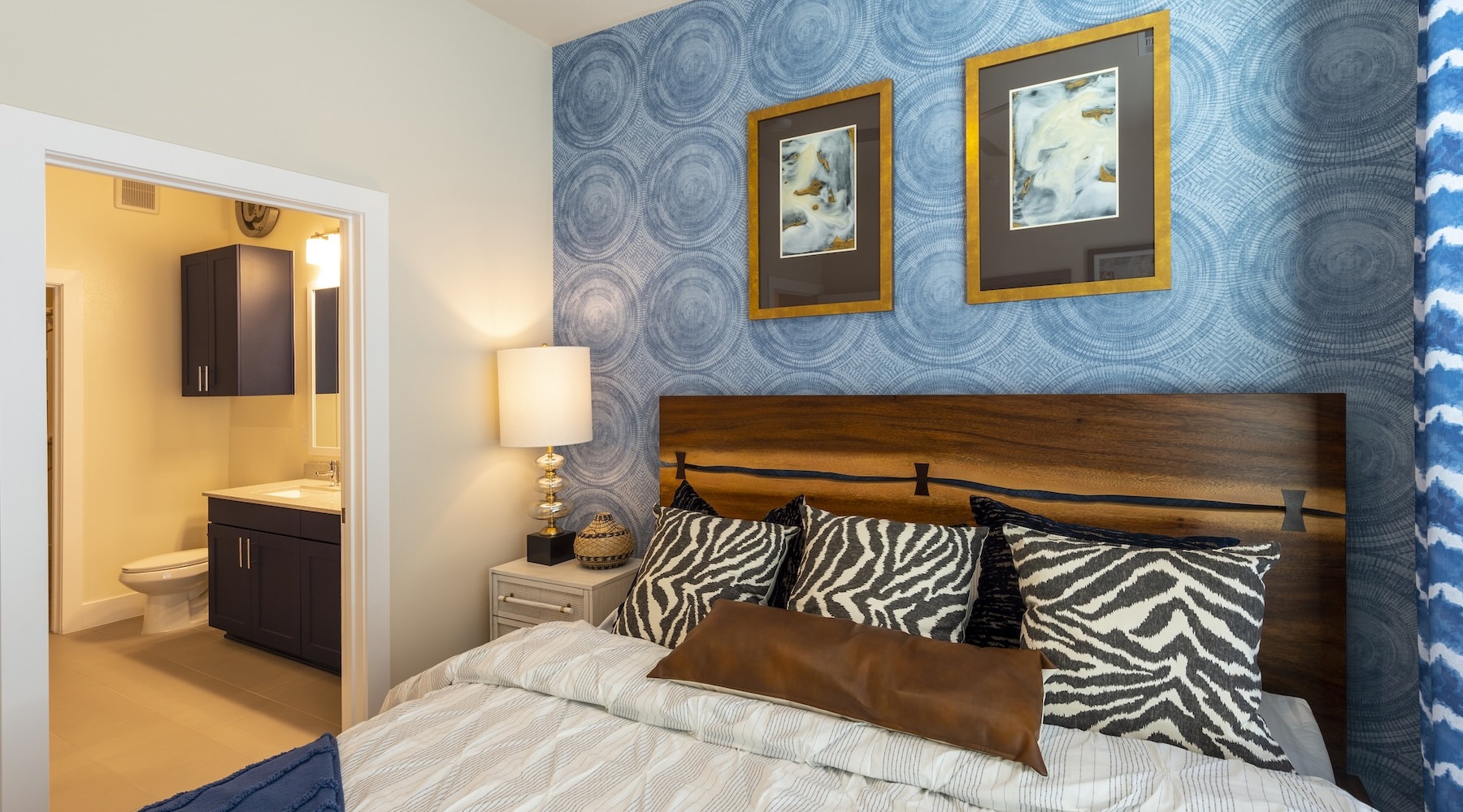 a bedroom with a bed and pillows